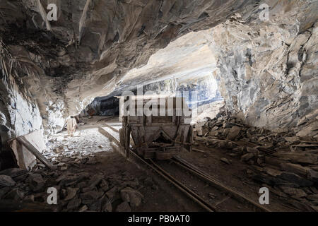 Mining trolley in a tunnel of an abandoned lime mine in Switzerland Stock Photo