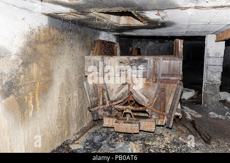 Mining trolley in a tunnel of an abandoned lime mine in Switzerland Stock Photo