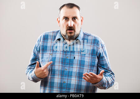 Portrait of man pointing at himself Stock Photo