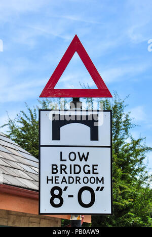 Road sign warning of a low bridge ahead on a road in the uk Stock Photo ...