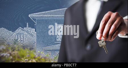 Composite image of close up of a businessman holding a key Stock Photo