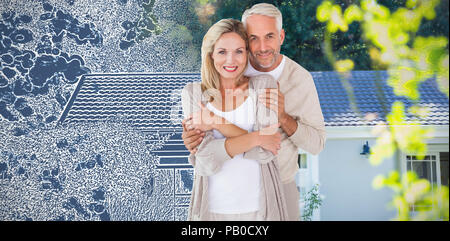 Composite image of portrait of husband embracing wife Stock Photo