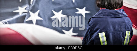 Composite image of female architect standing against white background Stock Photo