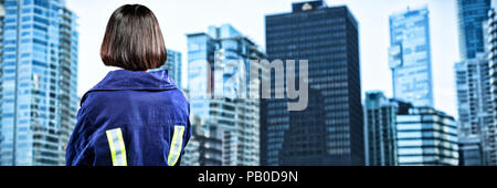 Composite image of female architect standing against white background Stock Photo