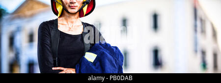 Composite image of female architect wearing helmet against white background Stock Photo