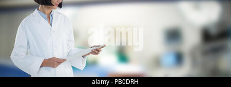 Composite image of doctor holding clipboard against white background Stock Photo