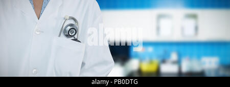 Composite image of doctor standing against grey background Stock Photo