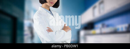 Composite image of doctor standing with arms crossed against white background Stock Photo