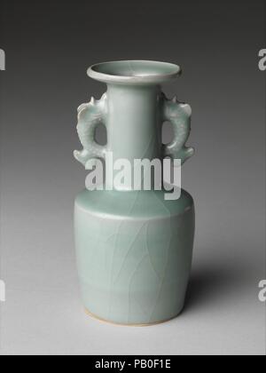 Vase with Dragonfish Handles. Culture: China. Dimensions: H. 6 3/4 in. (17.1 cm). Date: 12th-13th century.  Vases of this type were especially popular in Japan, where they were sometimes used in the tea ceremony. The vase's form, known as a mallet shape, can be traced to glass vessels produced in Syria in the ninth and tenth century and was most likely introduced to China at around that time. The fanciful handles are a Chinese addition. Museum: Metropolitan Museum of Art, New York, USA. Stock Photo