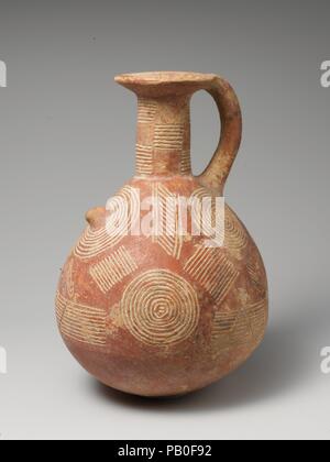 Terracotta jug. Culture: Cypriot. Dimensions: H. 7 5/16 in. (18.6 cm). Date: ca. 2500-1900 B.C..  Globular with handle, concentric circles and groups of lines. Museum: Metropolitan Museum of Art, New York, USA. Stock Photo