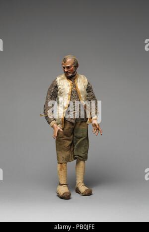 Bearded 'Innkeeper' with white furry vest, black/white shirt, brown knickers. Culture: Italian. Dimensions: Overall (confirmed): 12 1/2 × 5 × 4 in. (31.8 × 12.7 × 10.2 cm). Date: second half 18th-mid-19th century.  The practice of using crèche figures to restage religious events reached the height of its complexity and artistic excellence in eighteenth-century Naples, and the Metropolitan Museum of Art's group of Neapolitan crèche is one of the finest and most complete survivals of the art form. The ensemble consists of characters traditional to eighteenth-century Italian Christmas holiday cus Stock Photo