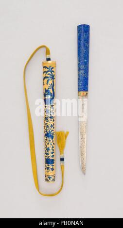 Imperial Knife with Sheath. Culture: Chinese. Dimensions: L. with sheath 11 1/4 in. (28.6 cm); L. without sheath 10 9/16 in. (26.8 cm); W. 15/16 in. (2.4 cm); Wt. 3.5 oz. (99.2 g); Wt. of sheath 4.9 oz. (138.9 g). Date: 18th century.  This elegant knife was intended as a personal accessory for a member of the imperial court, rather than as a weapon. It is part of a group of several known examples, all of which are similar in shape, size, and richness, but with each having some differences, particularly in the style and decoration of the sheaths. The gilding of their blades is a distinctive and Stock Photo