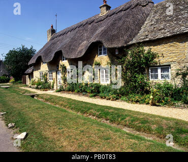 July 1995: Thatched cottage, Cotswold cottage, Minster Lovell, Oxfordshire, Cotswolds, England, UK, Europe Stock Photo