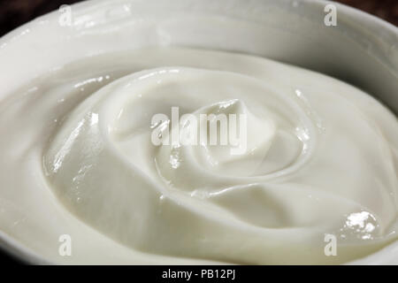 close up of a white whipped or sour cream in bowl Stock Photo