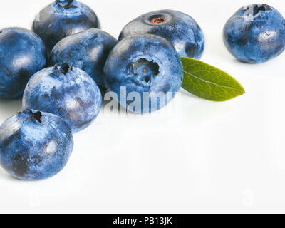 Blueberries isolated on white background. Creative layout of blueberry border design. Isolated one edge. Copy space. Stock Photo