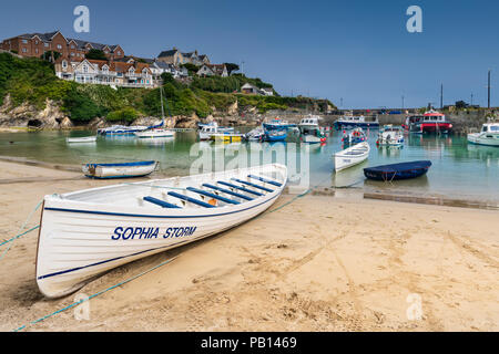 The heatwave continues and the popular holiday resort of Newquay in North Cornwall  is bathed in sunshine as the little fishing boats and pleasure cra Stock Photo