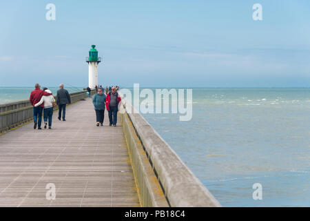 Calais, France - 19 June 2018: People walking on the west jetty in the summertime. Stock Photo