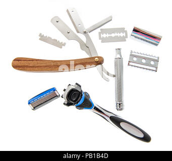 Three different kind of razors including safety, straight and disposable that are disassembled on an isolated background. Stock Photo