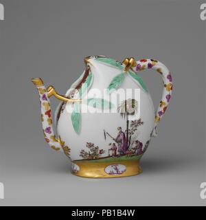 Wine pot in the shape of a peach (cadogan type). Culture: German, Meissen. Dimensions: Overall (confirmed): 5 1/2 x 7 x 3 1/2 in. (14 x 17.8 x 8.9 cm). Factory: Meissen Manufactory (German, 1710-present). Date: ca. 1725.  This unusual teapot is modeled in the form of a flattened peach; the spout and handle are joined to the body by means of short branches with leaves. With no opening at the top, the teapot was filled from a hole in the base that was plugged with a cork. The Meissen potters copied Chinese porcelain wine pots for the shape of the teapot, but the painted decoration is entirely Eu Stock Photo