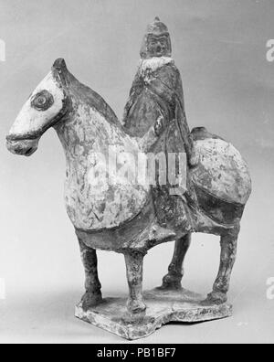 Figure of an Equestrian Soldier. Culture: China. Dimensions: H. 8 1/4 in. (21 cm); L. 7 1/2 in. (19.1 cm). Date: 5th-6th century. Museum: Metropolitan Museum of Art, New York, USA. Stock Photo