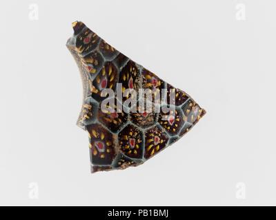 Glass mosaic bowl fragment. Culture: Roman. Dimensions: Overall: 1 1/2 x 1 7/16 in. (3.8 x 3.7 cm). Date: late 1st century B.C.-early 1st century A.D.. Museum: Metropolitan Museum of Art, New York, USA. Stock Photo