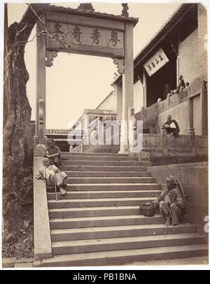 Beggars at the Gate of a Temple, Canton. Artist: Attributed to John Thomson (British, Edinburgh, Scotland 1837-1921 London). Dimensions: Image: 27.3 x 21.3 cm (10 3/4 x 8 3/8 in.). Date: ca. 1869.  From 1868 to 1872, Thomson assembled his masterful documentation of China, published after he returned to Britain as Foochow and the River Min (1873) and the four-volume Illustrations of China and Its People (1873-74).  Thomson's extensive travels took him throughout the Foochow region, on a three-thousand mile journey along the Yangzi, and to the western plains of Taiwan and the southern port citie Stock Photo