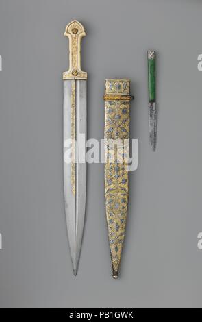 Dagger (Qama) with Sheath and Knife. Culture: Caucasian. Dimensions: Dagger (a); L. with sheath 19 1/4 in. (48.9 cm); L. without sheath 19 1/16 in. (48.4 cm); L. of blade 14 3/4 in. (37.5 cm); W. 1 3/4 in. (4.5 cm); D. 15/16 in. (2.4 cm); Wt. 12.8 oz. (362.9 g); Wt. of sheath 4.5 oz. (127.6 g); knife (c); L. 7 1/2 in. (19.1 cm); L. of blade 3 11/16 in. (9.4 cm); W. 9/16 in. (1.4 cm); D. 5/16 in. (0.8 cm); Wt. 0.8 oz. (22.7 g). Date: dated, 1856-57, 1861. Museum: Metropolitan Museum of Art, New York, USA. Stock Photo