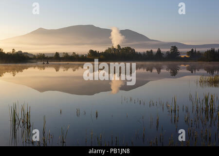 Reflection of Cherry Mountain in Airport Marsh, near Mt Washington Regional Airport, in Whitefield, New Hampshire USA a foggy summer morning. Stock Photo