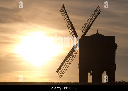 The sun sets on a warm summers day behind Chesterton Windmill in Warwickshire, UK. July 2018. Stock Photo