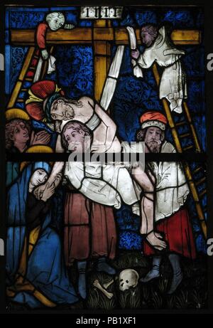 Stained Glass Panel with the Deposition. Culture: German. Dimensions: Overall (with 1 T-bar): 43 1/2 x 29 5/16 x 3/8 in. (110.5 x 74.5 x 1 cm)  Overall (installation opening): 41 3/4 x 28 3/8 in. (106 x 72.1 cm)  a: 21 7/8 x 29 1/4 x 3/8 in. (55.6 x 74.3 x 1 cm)  b: 21 3/4 x 29 1/4 x 3/8 in. (55.2 x 74.3 x 1 cm). Date: 15th century.  These panels were part of a window depicting the ancestry of Christ in the form of a Tree of Jesse (a complete example is shown opposite).  The painter of these windows adopted an angular style of drapery folds and subtle color juxtapositions initiating a new styl Stock Photo