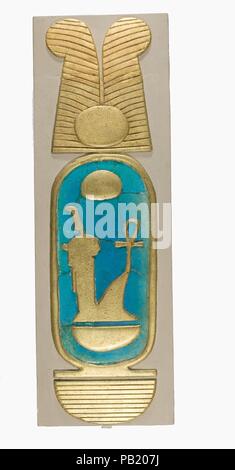 Reconstruction of a Cartouche of Amenhotep III. Dimensions: H. 52.1 cm (20 1/2 in); w. 15.4 cm (6 1/16 in); d. 5.4 cm (2 1/8 in.). Dynasty: Dynasty 18. Reign: reign of Amenhotep III. Date: ca. 1390-1353 B.C..  The blue faience tiles in this reconstruction were discovered during the Museum's excavations at Malqata, the site of a festival city built by Amenhotep III for the celebration of his three rejuvination festivals, or <i>heb seds</i>. The original cartouche was made of faience tiles and gilded plaster set into wood that was badly decayed and could not be preserved (see the excavation phot Stock Photo