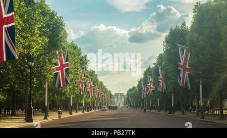 Union Jack Flags lining The Mall looking towards The Queen Victoris Memorial in front of Buckingham Palace, London, England Stock Photo