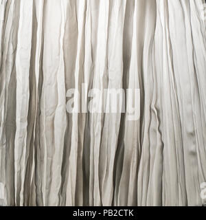 a crumpled white curtain as a background Stock Photo