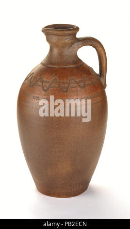 Clay pot of manual work. It is possible to store milk or other liquid Stock Photo