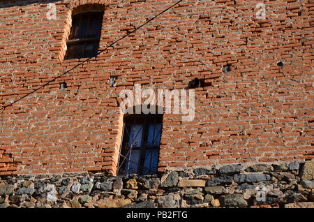 Vintage brick wall in a small vilage in the coutryside Stock Photo