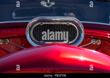 Close up of the chrome air intake of a red V8 hot rod in New Zealand Stock Photo