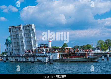 Drawbridge across the Schlei Fjord opens up for sailing boats and pleasure boat Freya to cross, Kappeln, Schleswig-Holstein, Germany Stock Photo