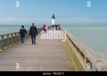 Calais, France - 19 June 2018: People walking on the west jetty in the summertime. Stock Photo
