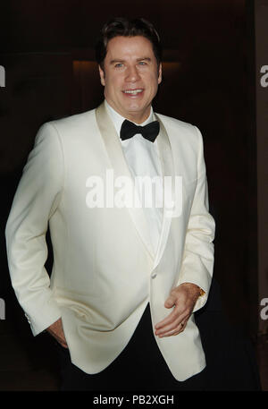 John Travolta arriving at the 5th Annual 'Legends of Aviation' awards ceremony at the Beverly Hilton In Los Angeles.  Three quarters white tuxedo jacketTravoltaJohn 09 Red Carpet Event, Vertical, USA, Film Industry, Celebrities,  Photography, Bestof, Arts Culture and Entertainment, Topix Celebrities fashion /  Vertical, Best of, Event in Hollywood Life - California,  Red Carpet and backstage, USA, Film Industry, Celebrities,  movie celebrities, TV celebrities, Music celebrities, Photography, Bestof, Arts Culture and Entertainment,  Topix, vertical, one person,, from the years , 2006 to 2009, i Stock Photo