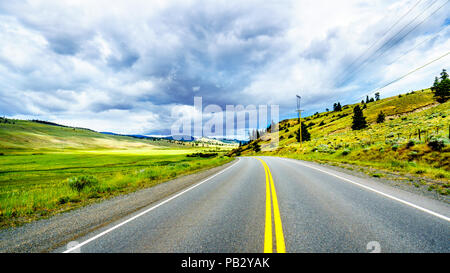 Fertile farmland and rolling hills along Highway 5A near Nicola Lake, between Kamloops and Merritt in the Okanagen region in BC, Canada Stock Photo