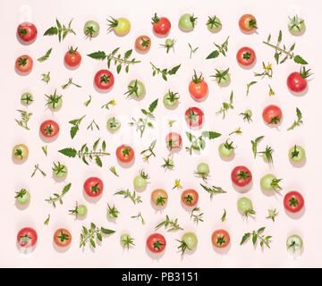 Fresh tomatoes and leaves, vegetables background. Stock Photo