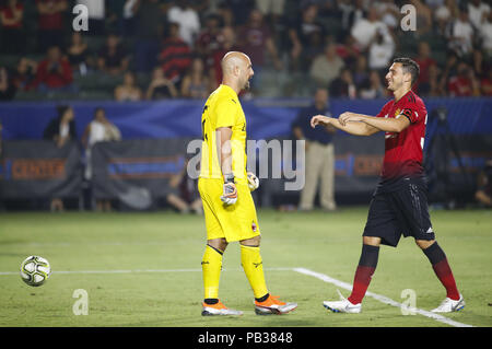 Los Angeles, California, USA. 25th July, 2018. AC Milan's goalkeeper Jose Reina greets with Manchester United's defender Darmian Matteo (36) during the International Champions Cup match on July 25, 2018 in Carson, California. Manchester United won 9-8 in a penalty shootout. Credit: Ringo Chiu/ZUMA Wire/Alamy Live News Stock Photo