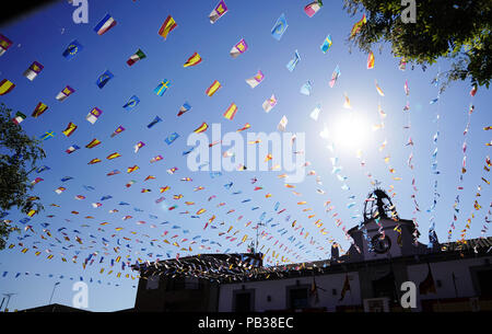 Carpio Tajo, Toledo, Spain. 25th July, 2018. View of the square adorned with flags before the festival.The St. James Festival in the village of El Carpio de Tajo near Toledo, Spain. The event involves horsemen galloping towards geese suspended by their feet as the mounted participant yanks on the bird's neck until it is torn off. Credit: Manu Reino/SOPA Images/ZUMA Wire/Alamy Live News Stock Photo