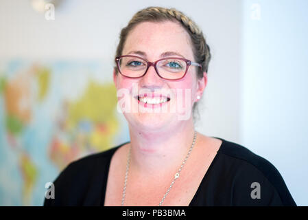 Gifhorn, Germany. 26th July, 2018. Linda Minkus, director of the Christian-Muslim kindergarten 'Abrahams Kinder' (lit.' Abraham's children'), smiles at the opening of the kindergarten. Behind the new project stands the Muslim DITIB mosque, the Catholic St. Altfrid parish and the Protestant foundation Diakonie. Credit: Hauke-Christian Dittrich/dpa/Alamy Live News Stock Photo