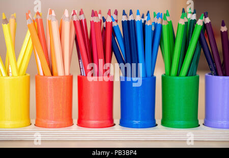 Gifhorn, Germany. 26th July, 2018. Pens in various colours stand on a table at the opening of the Christian-Muslim kindergarten 'Abrahams Kinder' (lit.' Abraham's children'). Behind the new project stand the Muslim DITIB mosque, the Catholic St. Altfrid parish and the Protestant foundation Diakonie. Credit: Hauke-Christian Dittrich/dpa/Alamy Live News Stock Photo