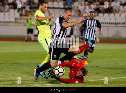 Belgrade, Serbia. 26th July, 2018. Partizan's Djordje Ivanovic (C) vies with Trakai's goalkeeper Tomas Svedkauskas (Bottom) during the second qualifying round UEFA Europa League football match in Belgrade, Serbia, July 26, 2018. Partizan won 1-0. Credit: Predrag Milosavljevic/Xinhua/Alamy Live News Stock Photo