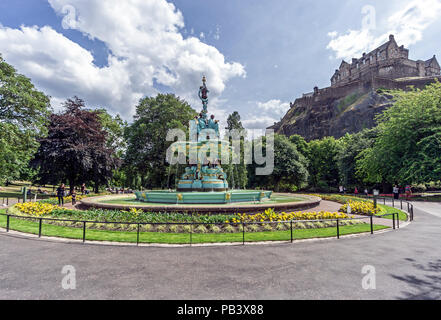 The restored Ross Fountain in West Princes Street Gardens Edinburgh Scotland with Edinburgh Castle in the background. Stock Photo