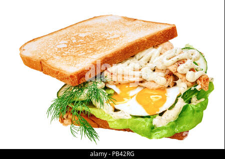Sandwich with white bread toasts, fried chicken, omelet and fresh green leaves of salad and sliced cucumber Stock Photo