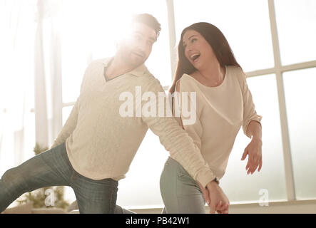 happy couple dancing in new house Stock Photo