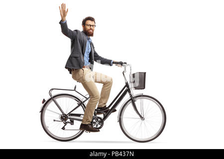 Bearded man riding a bicycle and waving at the camera isolated on white background Stock Photo